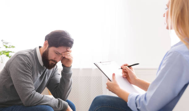 istock Depressed millennial man getting professional psychological help 2196342287