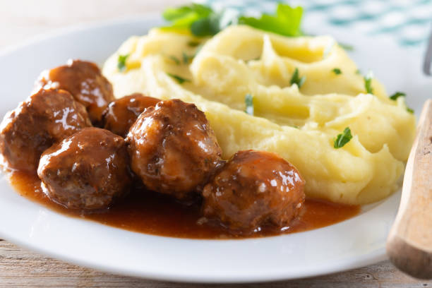 istock Meatballs with mashed potatoes on wooden table 2196346057