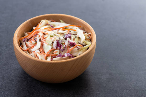 istock Coleslaw salad on black slate background. Close up 2196346281