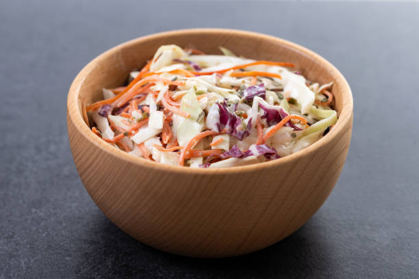 istock Coleslaw salad on black slate background. Close up 2196346292