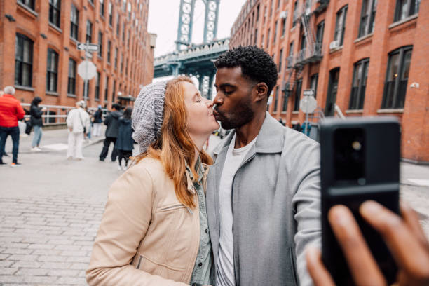 istock Multi ethnic couple taking a selfie in New York 2196348082