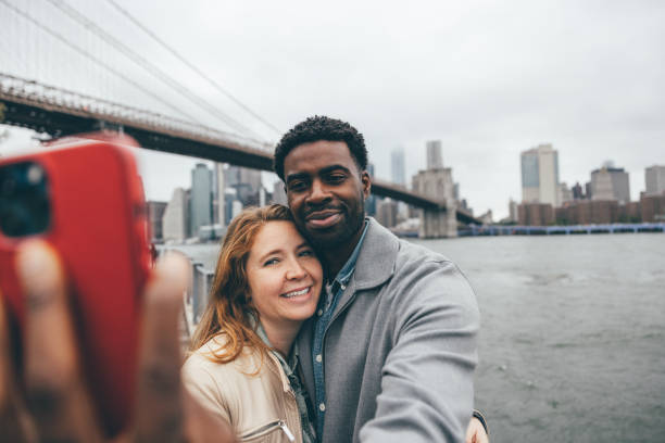 istock Multi ethnic couple taking a selfie in New York 2196348471