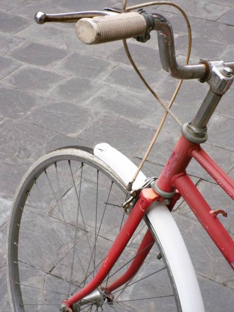 istock Old red bicycle parked on the street 2196349545