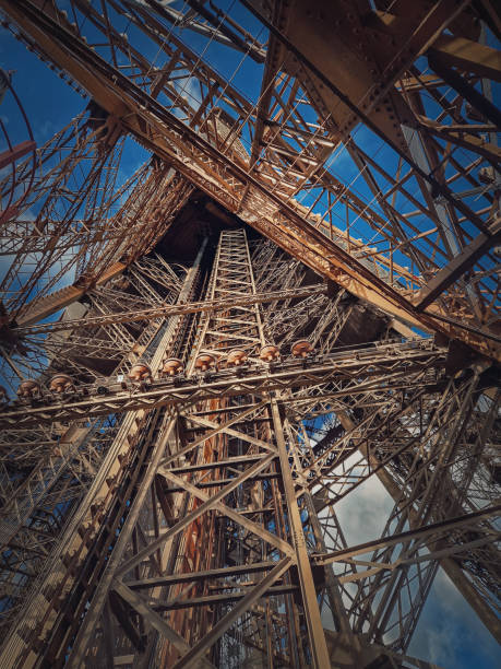 Capture the mesmerizing beauty of the Eiffel Tower's intricate details, a visual symphony of elegance and harmony in the heart of Paris