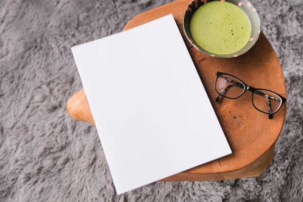istock blank magazine mockup on coffee table with green matcha tea 2196351483