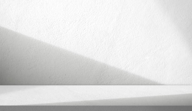 istock Empty grey cement wall room interior background with top shelf concrete floor perspective window light shadow overlay well material design display product stand and text present n free space backdrop 2196351583