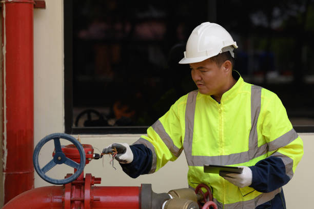 istock Engineers are checking the pipes and valves of the fire pump system. 2196353143