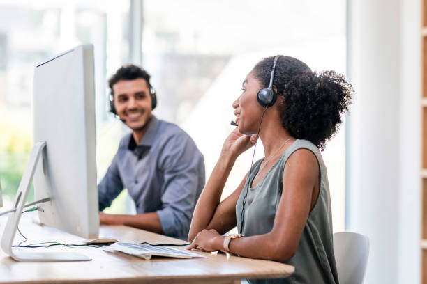 istock Team of Young Professionals Collaborating in a Modern Office Environment 2196353229