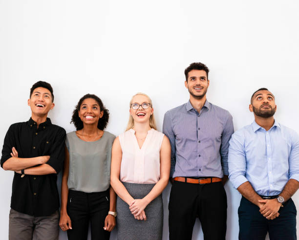istock Diverse Team of Young Professionals Smiling Confidently Against a White Background 2196353799