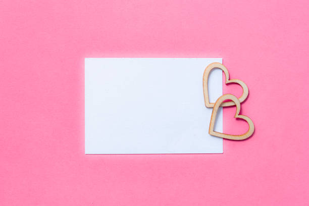 istock Blank card with two heart shapes on pink background. Copy space 2196355405