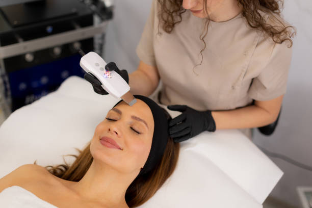 istock Relaxing facial cleansing experience with ultrasonic massager in a serene spa setting 2196355879