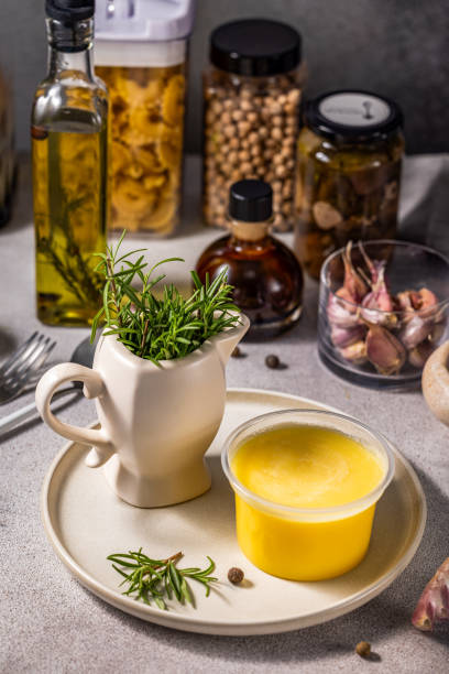 istock Ghee butter, rosemary and various ingredients creating a flavorful culinary scene 2196359216