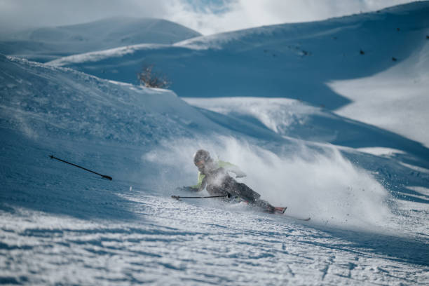 istock Skier falling during a downhill run on a snowy mountain slope 2196361338