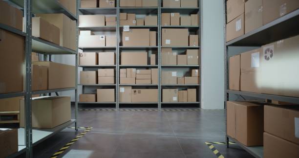 istock Postal Sorting Center with E-Commerce Goods in Cardboard Boxes on Shelves 2196361504