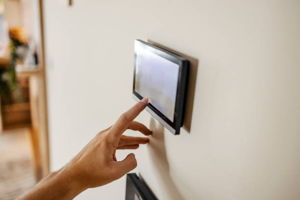 istock Close up of hand pressing touch screen at smart home. 2196363066