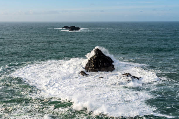 istock Crashing waves over rocky Dinas Head in Cornwall 2196364812