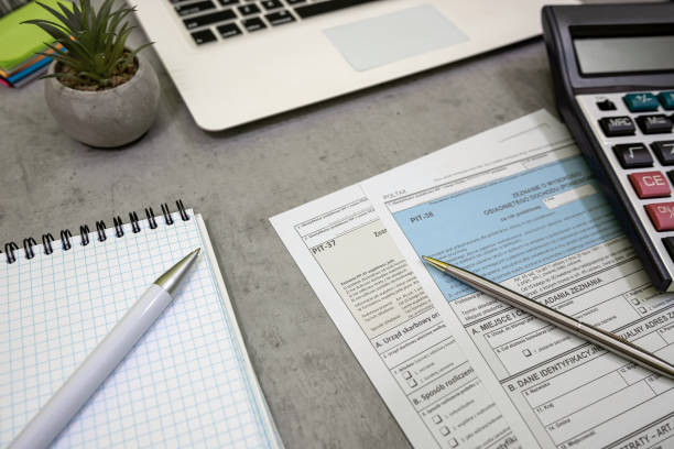 istock Polish tax forms PIT 36 PIT 37 PIT 38 with pen personal income tax 2196370908