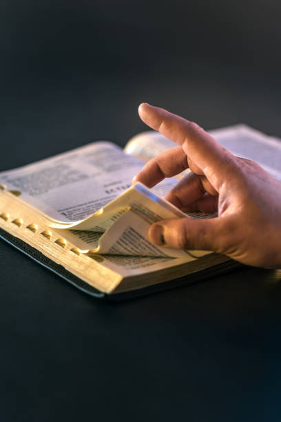 istock Open Bible close-up. Christianity concept. Reading God's Holy Bible. 2196371431