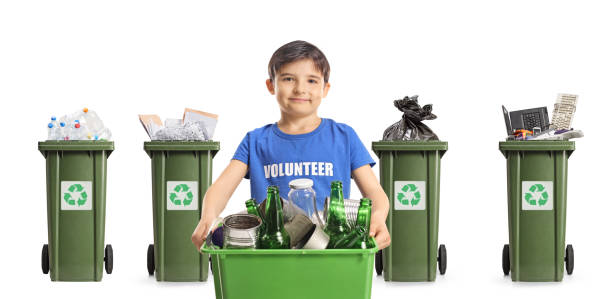 istock Boy volunteer holding a box with recycling bottles and cans 2196372371