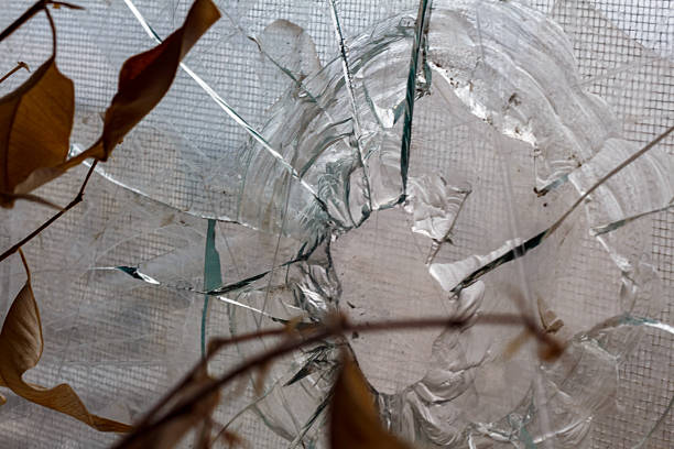 A hole in the window glass from a shell fragment