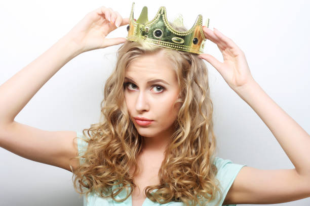 istock young lovely woman in crown 2196378568