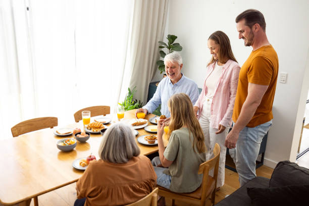 istock Happy Multigenerational Family Sharing a Breakfast Meal Around a Dining Table 2196380639