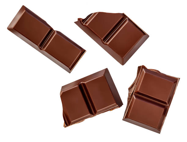 istock Falling Milk chocolate bar pieces isolated on white. Dark chocolate flying in the air.  Chocolate bar pieces  levitating. 2196382569