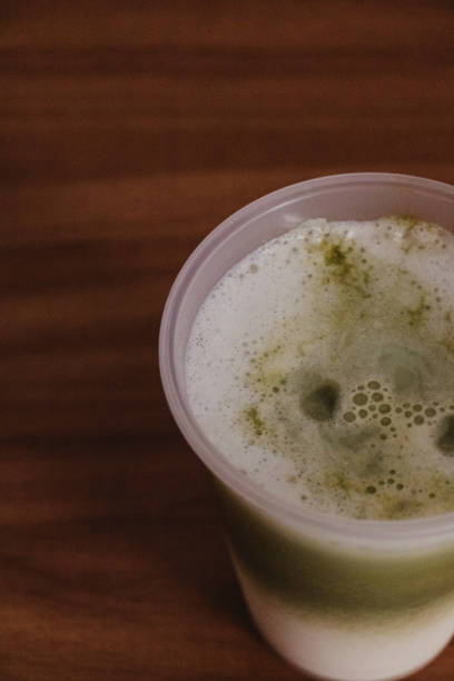 creamy iced matcha latte closeup
