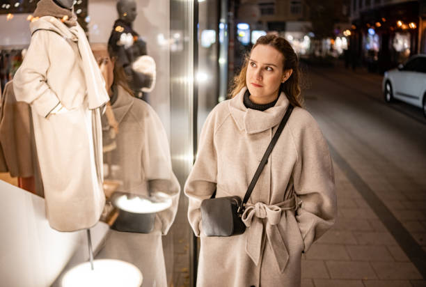 istock City Night Stroll Past a Fashion Store Window 2196388143