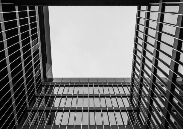 istock Low view of a modern office building against sky 2196389046