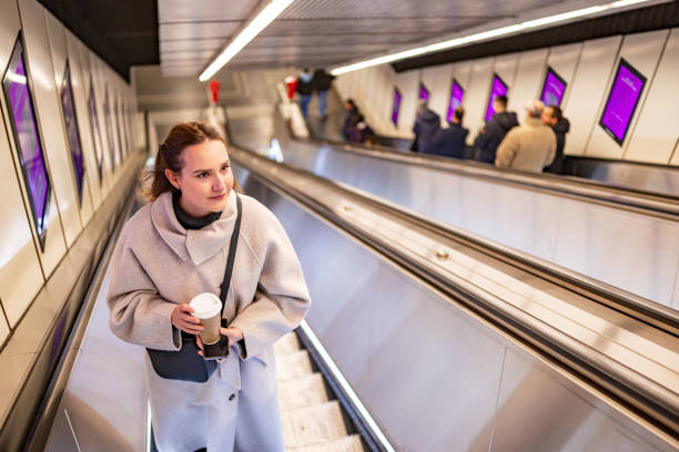 istock Coffee in Hand on the Subway Escalator 2196390435