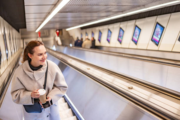 istock Balancing Coffee and City Commutes on the Subway Escalator 2196390483