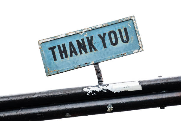 istock Thank you text written on an aged blue plate with white isolated backgound 2196390942