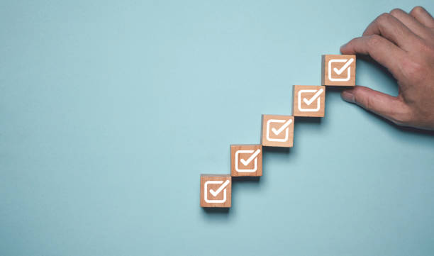 istock Hand holding correct or tick sign mark for quality document control checklist and business approve project concept. 2196390961