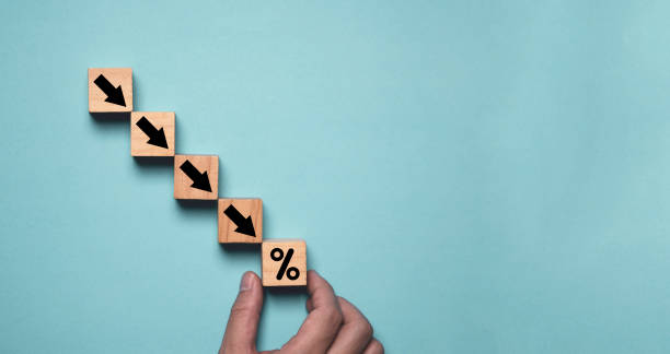 istock Hand holding percentage with down arrow on blue background and copy space for decreasing of business investment debt interest and economic recession concept. 2196391056