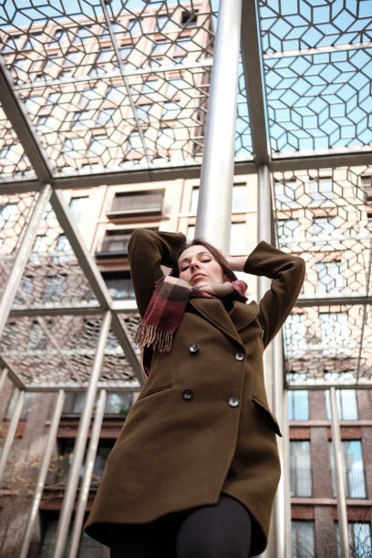 istock Businesswoman relaxing under modern architecture canopy 2196392433