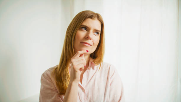 istock The woman thinks and ponders. Studio shot. 2196394174