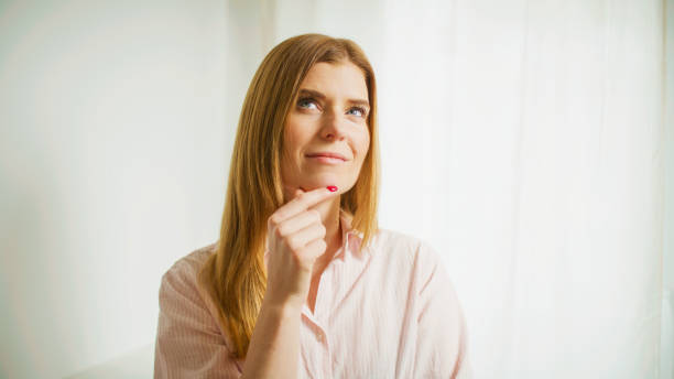 istock The woman thinks and ponders. Studio shot. 2196394192
