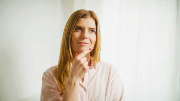istock The woman thinks and ponders. Studio shot. 2196394196