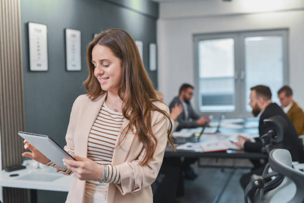 istock Female Manager Receiving Positive Client Feedback on Mail Looking at Tablet Joyfully 2196396299