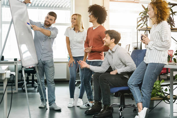 Group of Diverse Colleagues Collaborating in a Modern Office During a Team Brainstorming Session