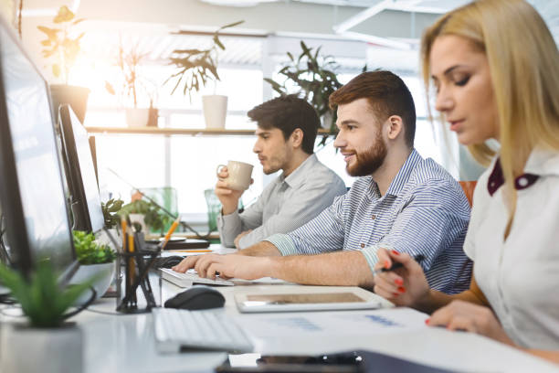 istock Young millennial people working on computers at coworking 2196397303
