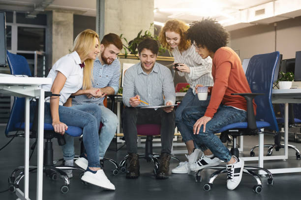 istock Young creative team discussing new project in coworking space 2196397307