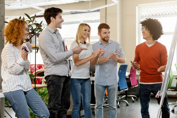 istock Business team appreciating colleague for explaining presentation 2196397342