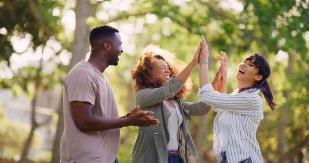 istock Students, success and high five outdoor for teamwork, clapping and education goal. Excited people, celebration and hands together with friends for exam pass, college acceptance or target achievement 2196398149