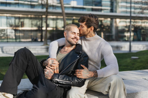 istock Playful kiss shared between two lovers outdoors 2196402605