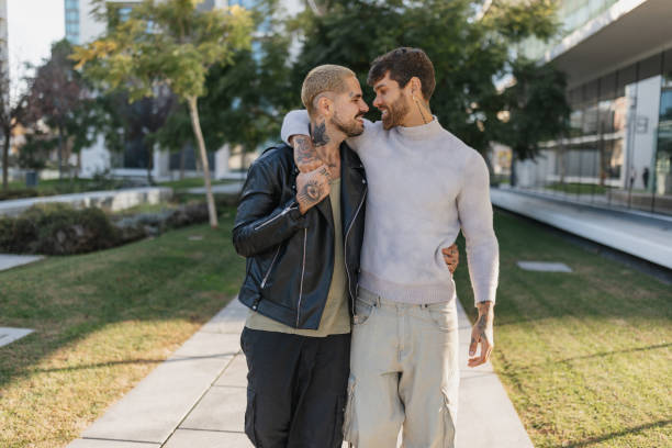 istock Joyful embrace between two stylish individuals 2196403019