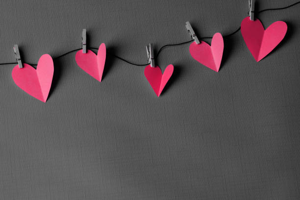 istock Paper hearts hanging on a clothesline with space for copy 2196403249