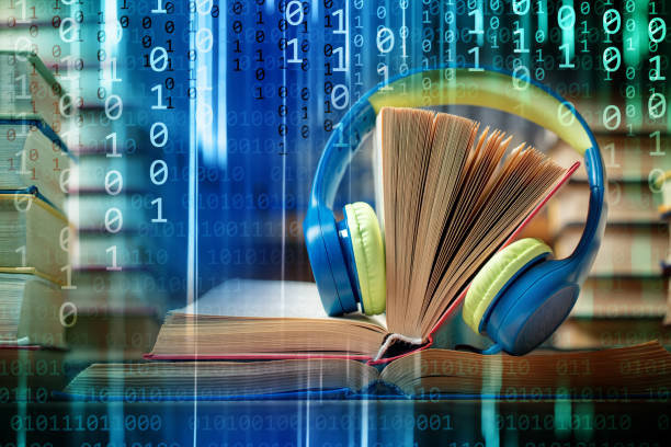 istock Audio book concept - headphones with stacks of books on a binary code background 2196403570