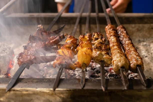 istock Delicious skewers grilling over hot coals. 2196403804